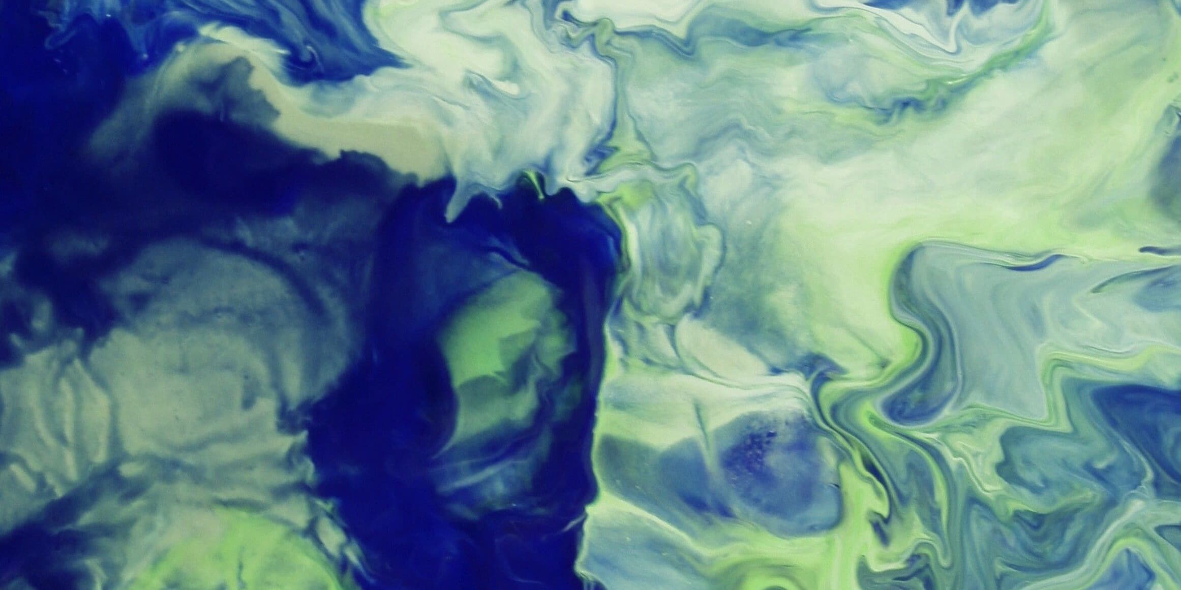Swirling blue and green fluid patterns